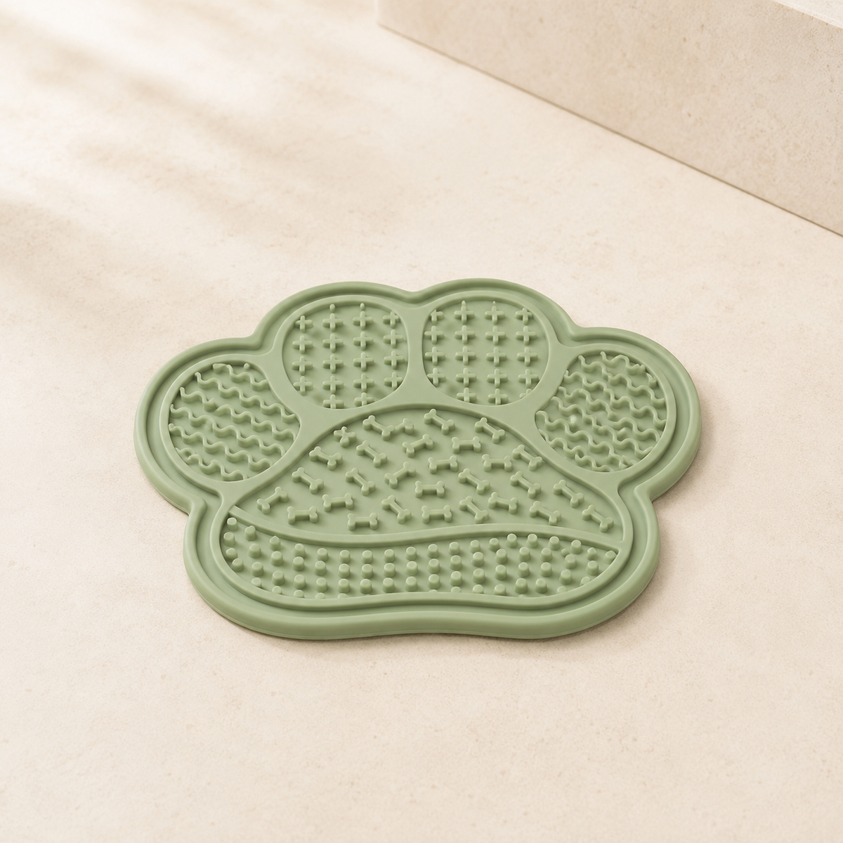 Sage green paw-shaped suction lick mat